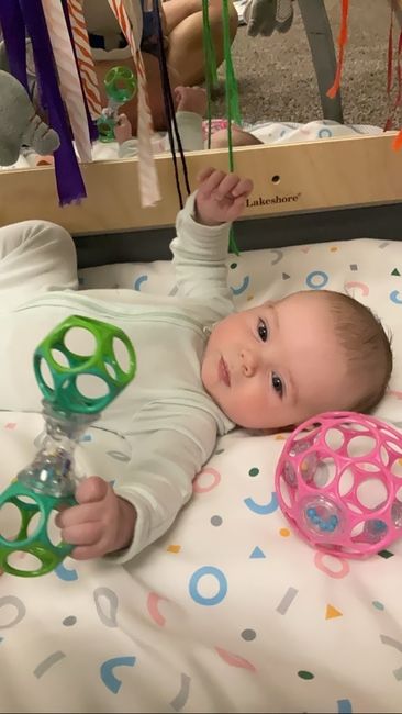 Exploring toys during floor time