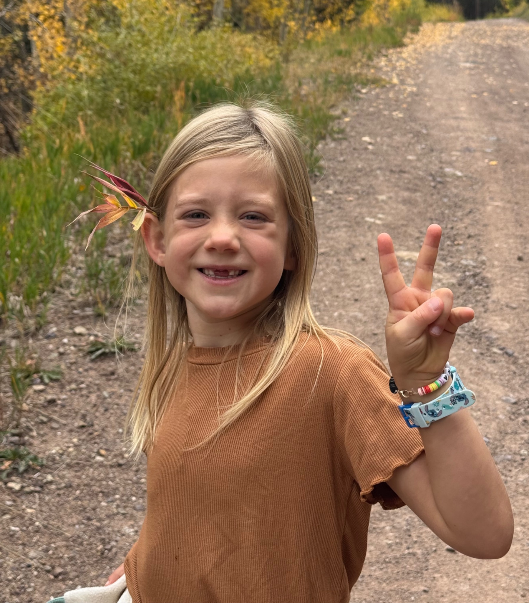 A child exploring outdoors on a nature trail