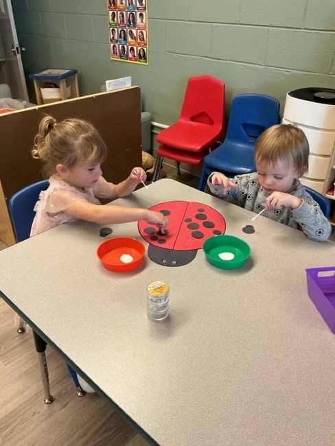 Preschoolers enjoying a hands-on classroom game